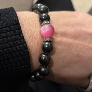 Magnetic Black Hematite Stretch Bracelet with one pink agate focal point.